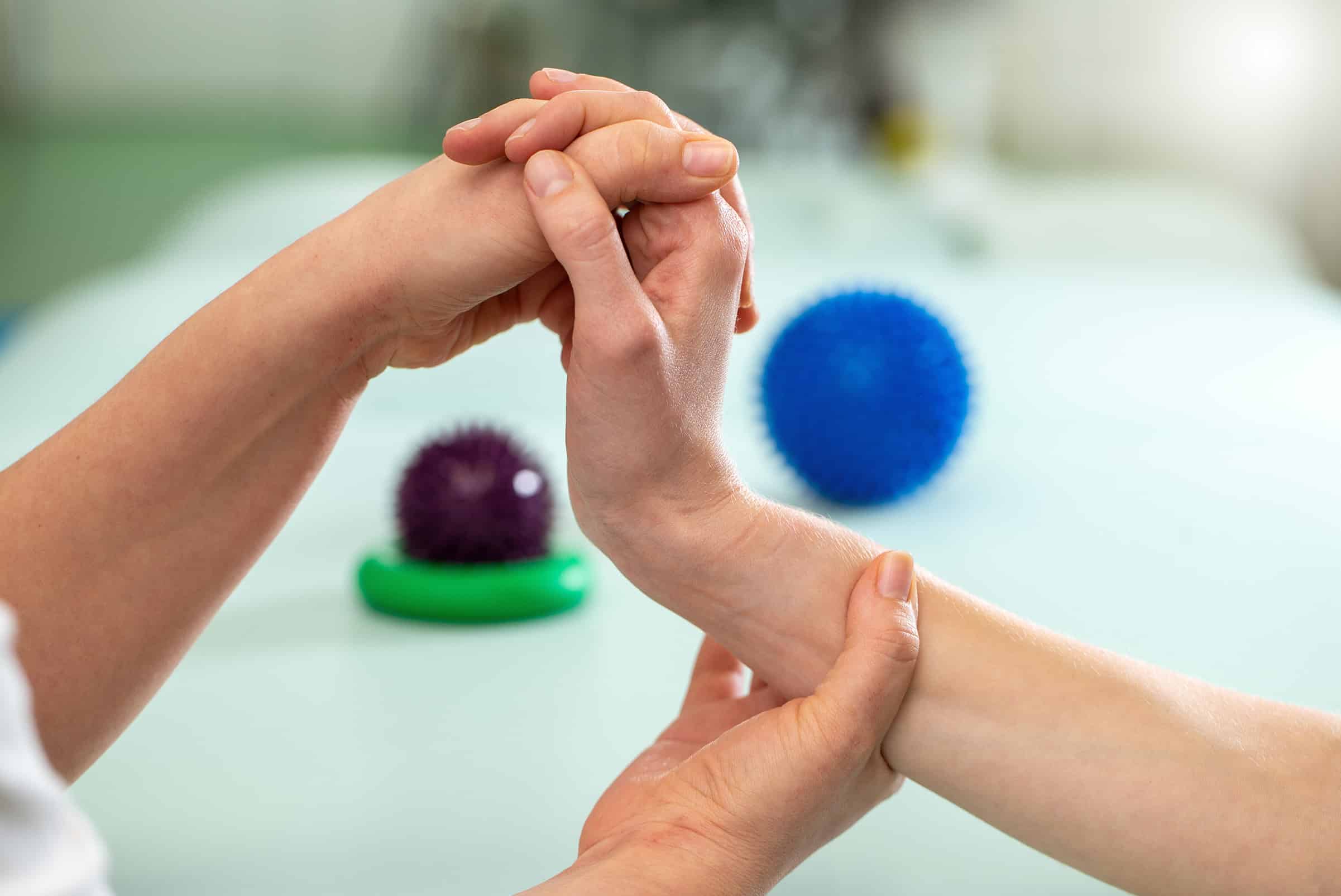 Close-up of hand and wrist treatment during physiotherapy for arthritis in Calgary